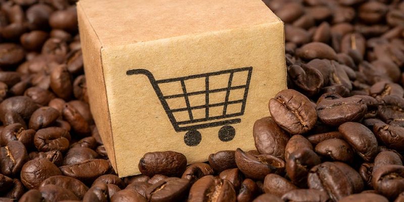 Box with shopping cart logo symbol on coffee beans  : Import Export Shopping online or eCommerce delivery service store product shipping, trade, supplier concept.